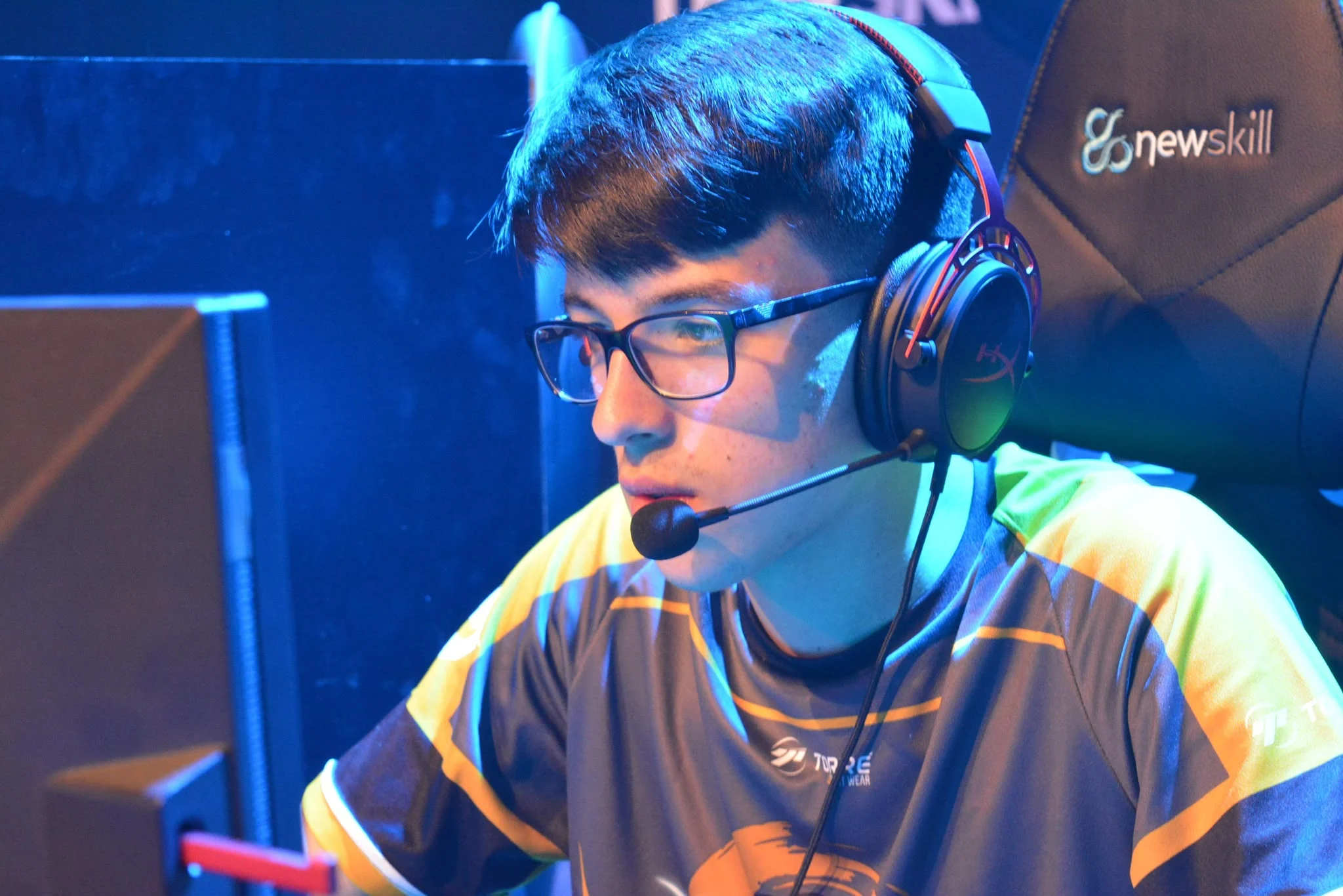 Victor Gonzalez competing on stage at an esports event